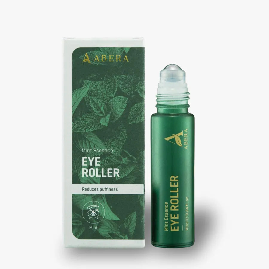 Abera Mint Essence Eye Roller bottle and its matching packaging box, both in green with gold lettering, set against a plain light gray background.