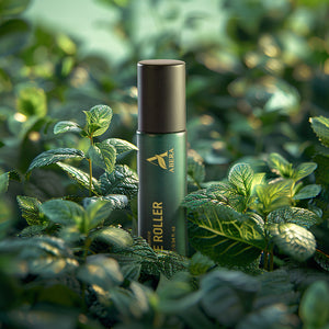 ABERA cooling eye roller serum displayed among fresh mint leaves, featuring mint essence for refreshed tired-looking eyes.